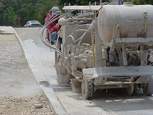 The existing curb is cut for the driveway entrance.