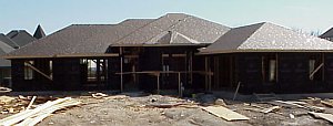 Black felt has been placed on top of the roof decking to protect the wood from water.