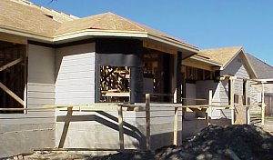 A view of the back of the house on February 14, 1999.  This picture shows the initial "hardi plank" siding that has been installed and also the roof decking.