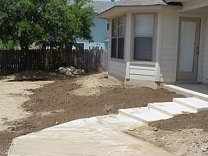 Once the workers were finished with the sprinkler system, they added topsoil to several areas as specified by the landscape architect.