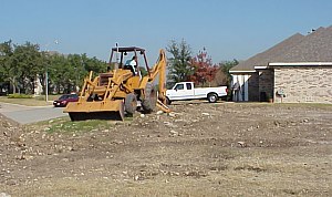 Clearing the front of the lot- pictures from the building of a custom home.