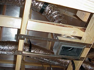 A view upward showing the air conditioning / heating ducts in the attic.