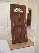 The front door is being stained on site.  The color of the stain was selected by the owners.