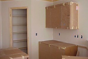 All of the cabinets are covered to protect them during painting.
