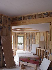 The picture above shows the insulation installed in the walls and the sheet rock nailed to the ceilings.