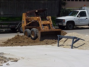 The land is graded properly for drainage, the land is cleared, and topsoil is added (shown above).